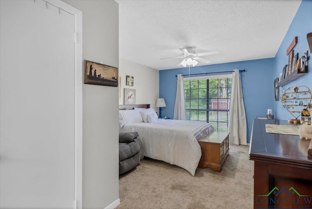 918 S Evenside St, Henderson, TX 75654 - bedroom with light colored carpet, a textured ceiling, and ceiling fan