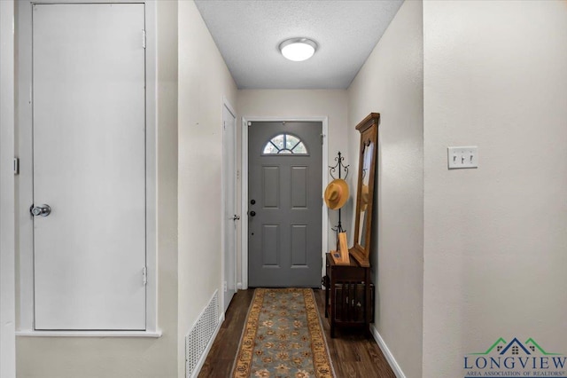 918 S Evenside St, Henderson, TX 75654 - entryway featuring dark wood-type flooring and baseboards