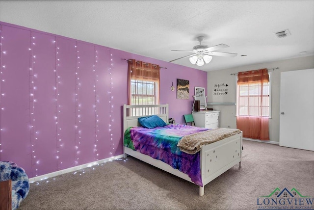 918 S Evenside St, Henderson, TX 75654 - carpeted bedroom featuring a textured ceiling