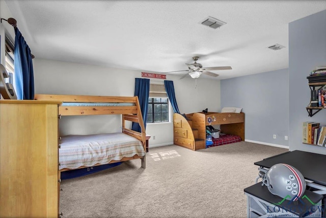 918 S Evenside St, Henderson, TX 75654 - carpeted bedroom with baseboards and ceiling fan