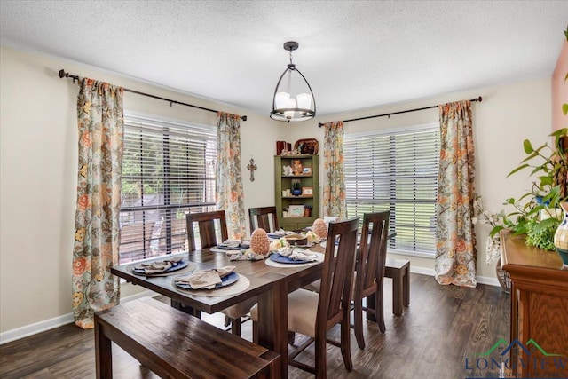 918 S Evenside St, Henderson, TX 75654 - dining room with baseboards, dark wood-type flooring, and a textured ceiling