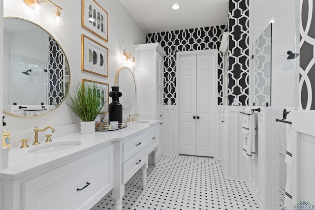 1307 Yates Dr, Longview, TX 75601 - bathroom with a walk in shower, double vanity, and tile patterned floors