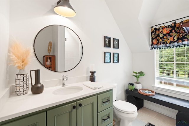 1307 Yates Dr, Longview, TX 75601 - bathroom with vanity, vaulted ceiling, toilet, and tile patterned flooring