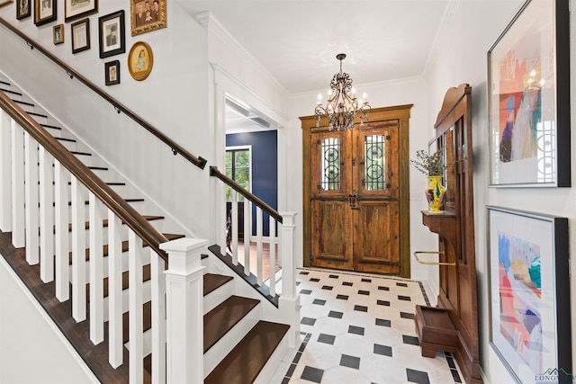 1307 Yates Dr, Longview, TX 75601 - foyer with a chandelier, stairs, tile patterned floors, and ornamental molding