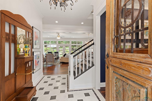 1307 Yates Dr, Longview, TX 75601 - entryway with ornamental molding, stairway, baseboards, a chandelier, and a ceiling fan