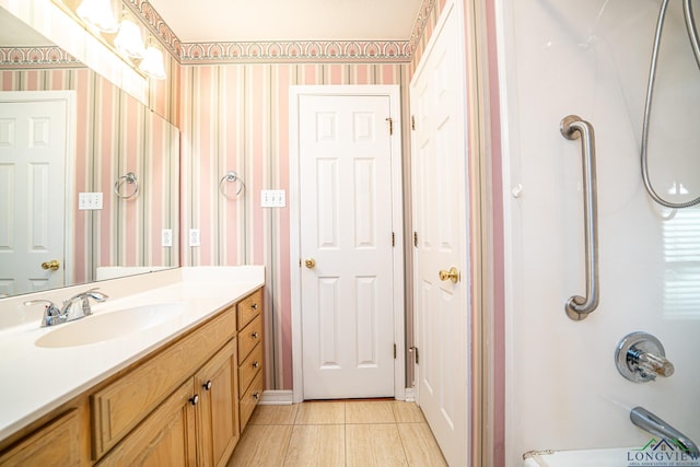 bathroom featuring vanity and shower / bath combination