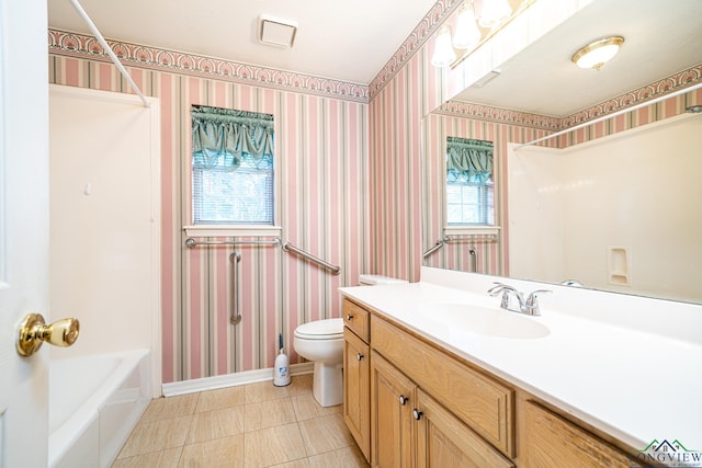 full bathroom with shower / bathtub combination, vanity, toilet, and plenty of natural light