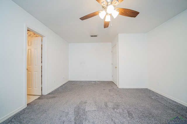 unfurnished room with light colored carpet and ceiling fan