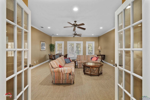 carpeted living room featuring ceiling fan, french doors, and crown molding