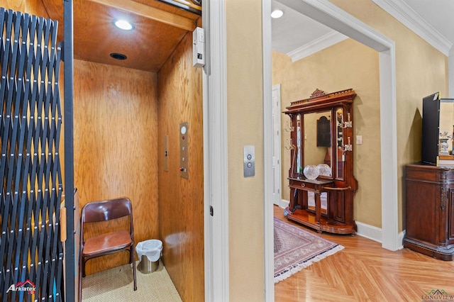 details featuring parquet floors, elevator, and ornamental molding