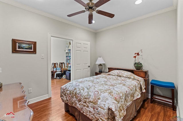 bedroom featuring ceiling fan, crown molding, and wood-type flooring