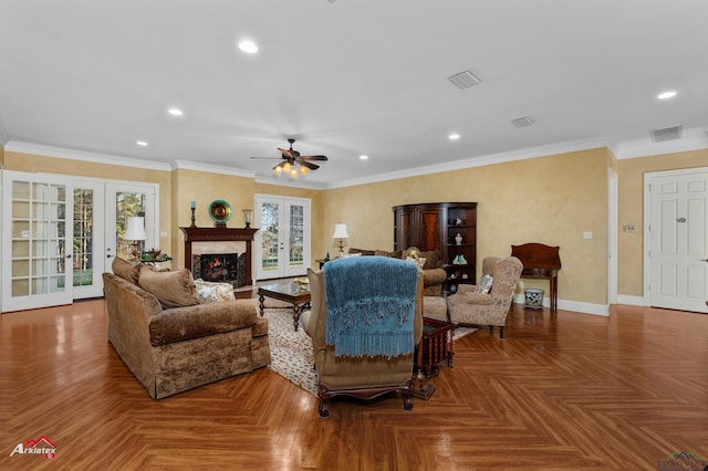 living room featuring french doors, crown molding, a fireplace, and parquet flooring