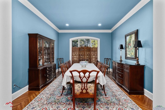 dining area with ornamental molding and parquet floors