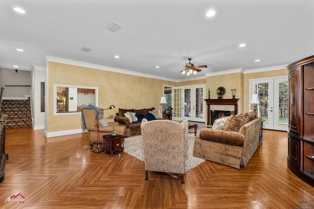 living room with ornamental molding, french doors, and light parquet floors