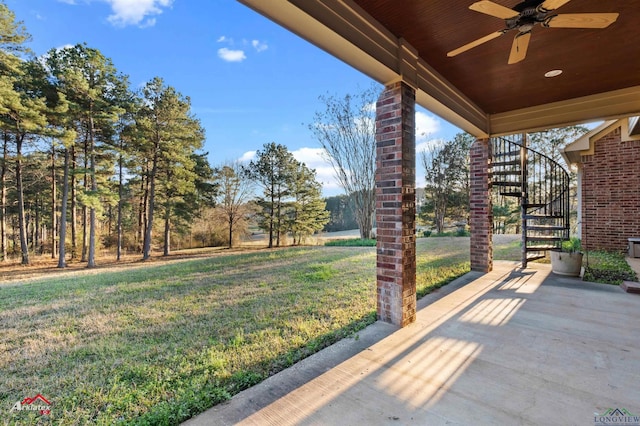 exterior space with ceiling fan