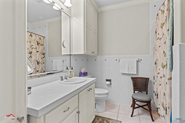 bathroom with tile patterned floors, ornamental molding, vanity, and toilet