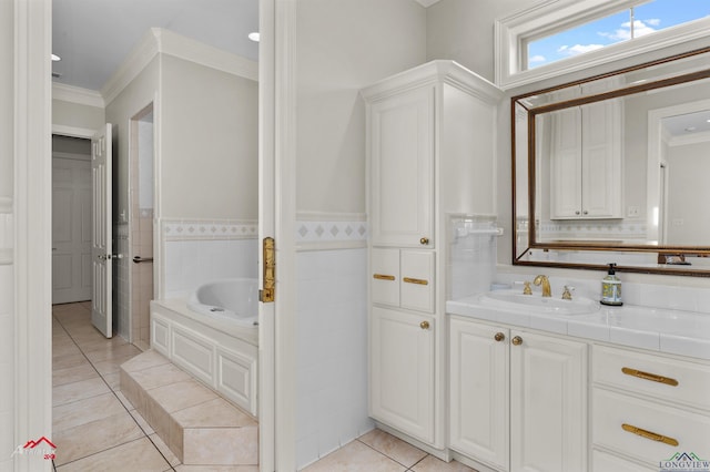 bathroom with a bath, tile patterned floors, vanity, and ornamental molding