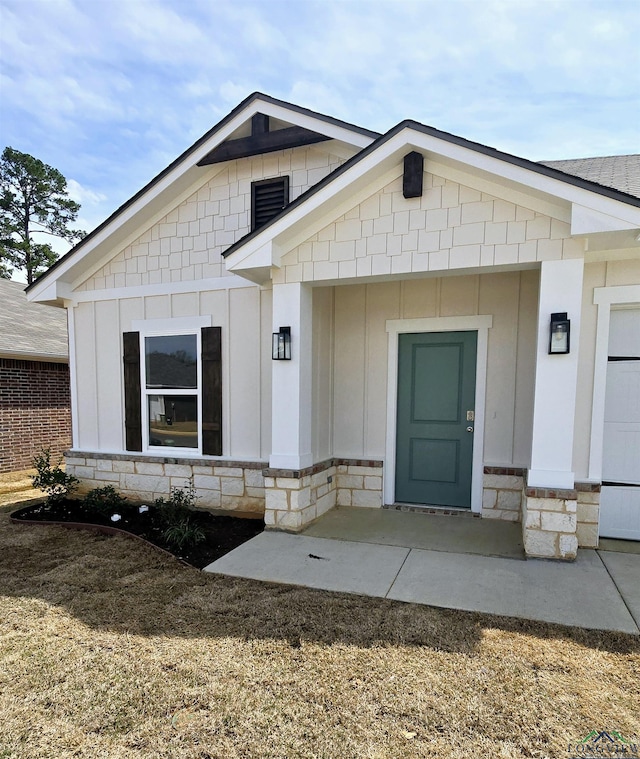 1121 Mission Creek Dr, Longview, TX 75601 - property entrance featuring board and batten siding