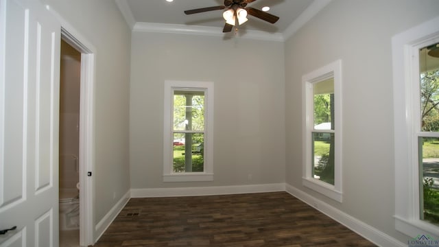 empty room featuring ceiling fan, dark hardwood / wood-style flooring, and ornamental molding