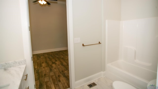 bathroom featuring hardwood / wood-style flooring, vanity, and toilet