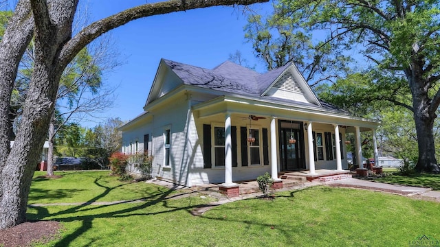 exterior space featuring a porch and a lawn