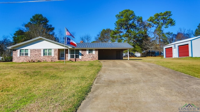 ranch-style home featuring a carport, a garage, and a front yard