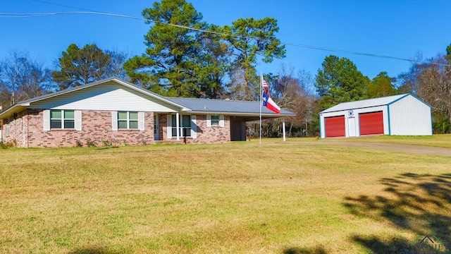 single story home with a front lawn, a carport, an outdoor structure, and a garage