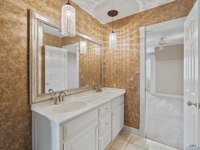 bathroom with ceiling fan, tile patterned flooring, and vanity