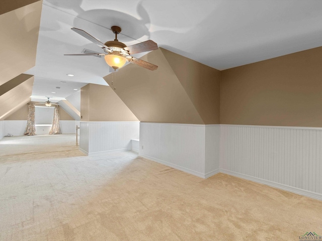 bonus room featuring light colored carpet, ceiling fan, and lofted ceiling