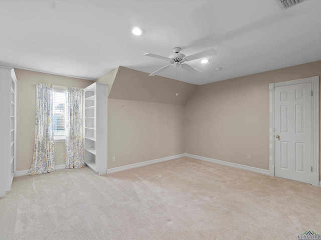 bonus room with light colored carpet, ceiling fan, and lofted ceiling