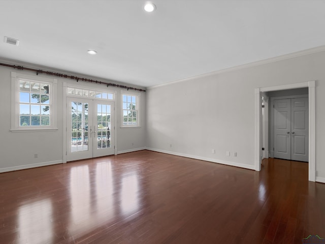 unfurnished room with french doors, dark wood-type flooring, and crown molding