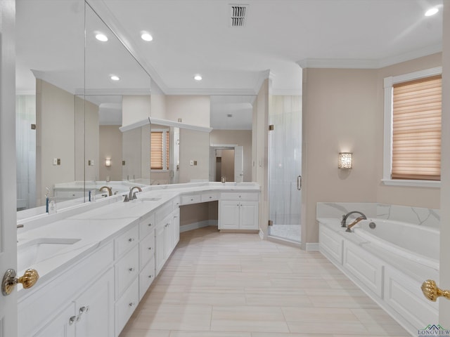 bathroom featuring plus walk in shower, vanity, ornamental molding, and tile patterned flooring