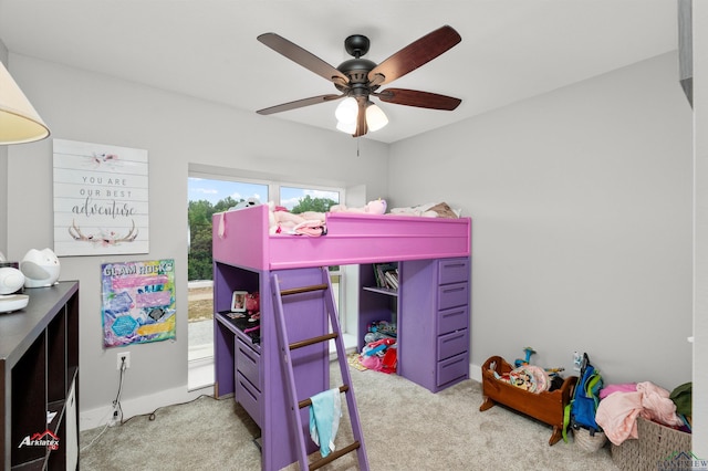 carpeted bedroom featuring multiple windows and ceiling fan