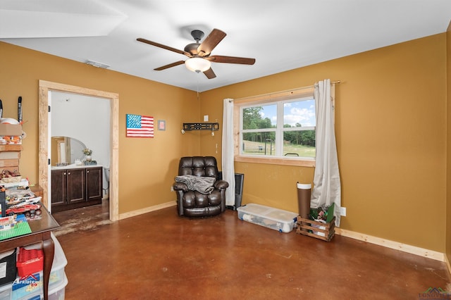 living area featuring ceiling fan