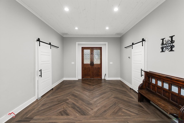 entryway featuring dark parquet flooring, a barn door, and crown molding