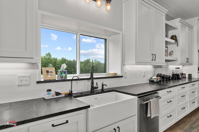 kitchen featuring backsplash, dark wood-type flooring, sink, dishwasher, and white cabinetry