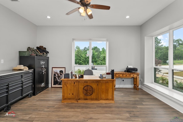 office with ceiling fan and dark wood-type flooring