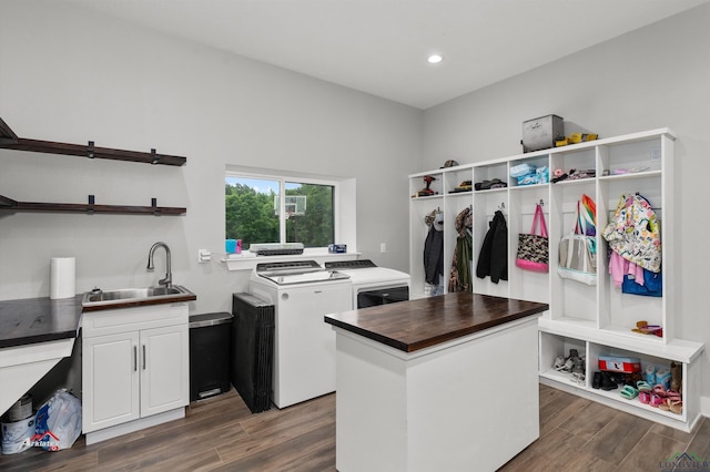 interior space featuring cabinets, separate washer and dryer, and sink