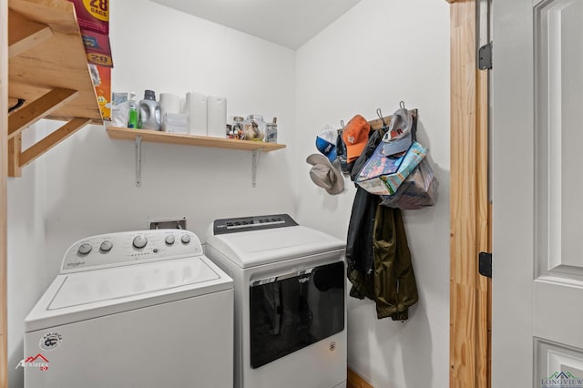 laundry area with washing machine and clothes dryer