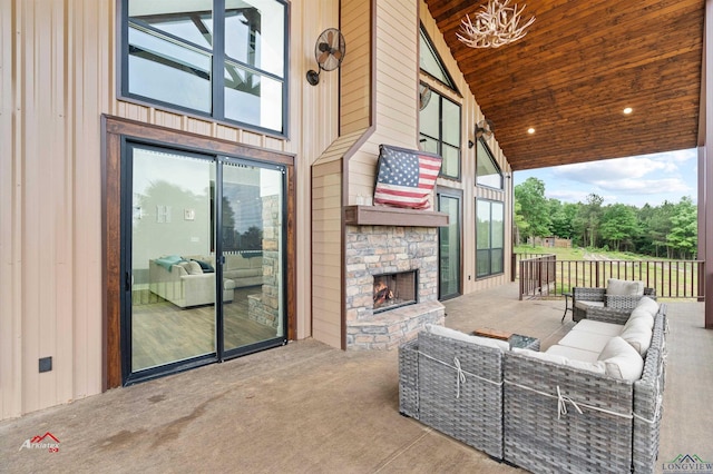 view of patio / terrace featuring an outdoor living space with a fireplace