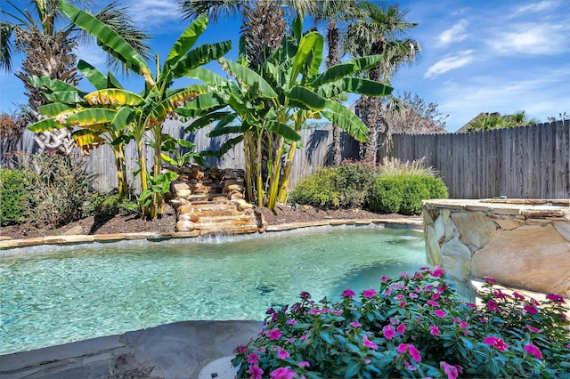 view of swimming pool featuring pool water feature