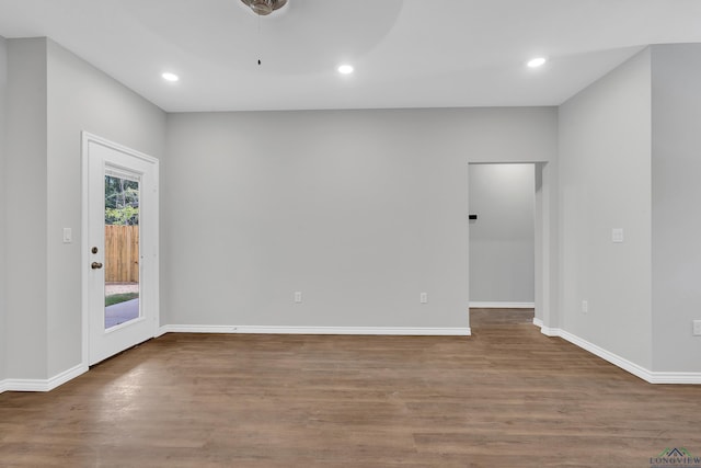 empty room featuring wood-type flooring