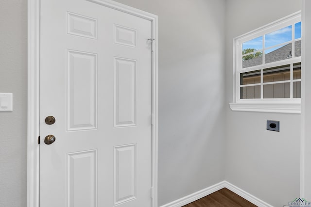 laundry room featuring hookup for an electric dryer and dark hardwood / wood-style flooring