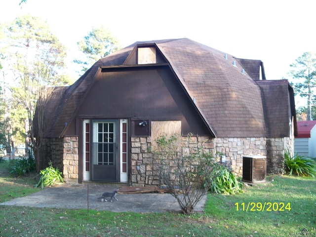 back of property featuring a patio area and central AC