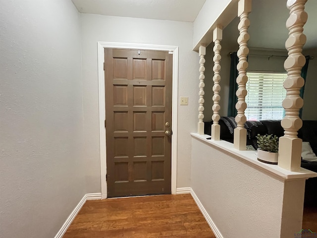 209 Lake Lamond Rd, Longview, TX 75604 - doorway with wood finished floors and baseboards