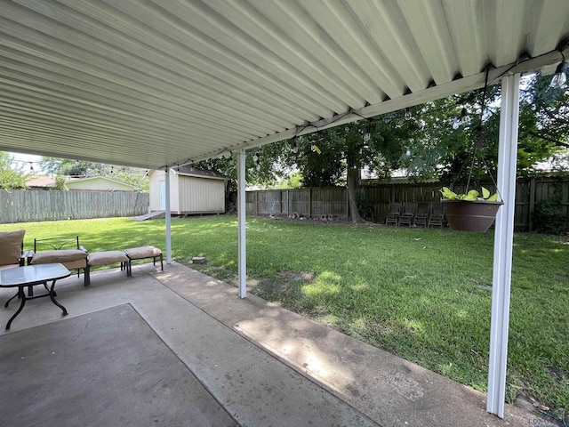 209 Lake Lamond Rd, Longview, TX 75604 - fenced backyard featuring a patio and a storage shed