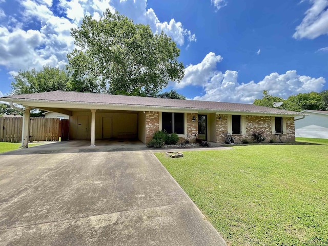 209 Lake Lamond Rd, Longview, TX 75604 - single story home with concrete driveway, a carport, brick siding, and a shingled roof