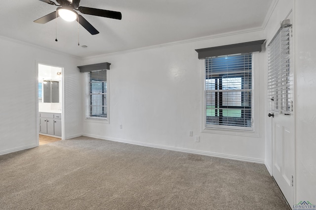 empty room featuring baseboards, ornamental molding, carpet flooring, and ceiling fan
