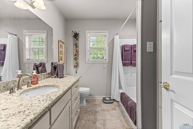 8 Honeysuckle Ln, Longview, TX 75605 - full bathroom featuring plenty of natural light, vanity, toilet, and baseboards
