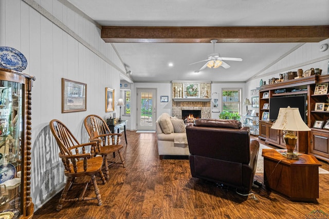 8 Honeysuckle Ln, Longview, TX 75605 - living area with wood finished floors, a ceiling fan, and a fireplace